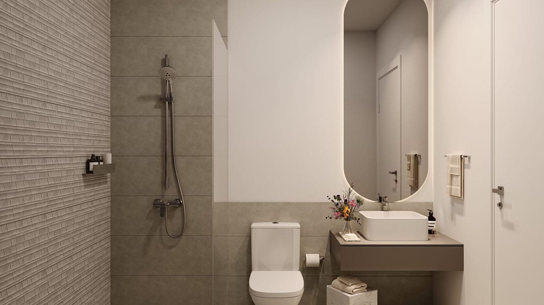 Modern minimalist bathroom with walk-in shower, oval mirror, and sleek neutral-toned design