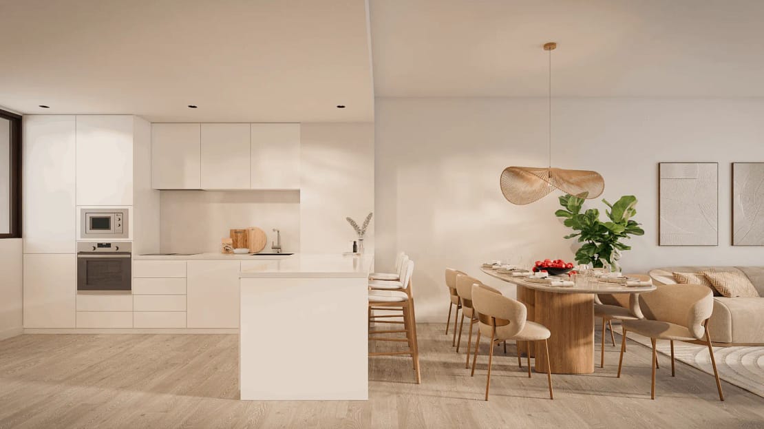 Cream-coloured living room with earthy modern design, sleek furniture, and an open-plan kitche